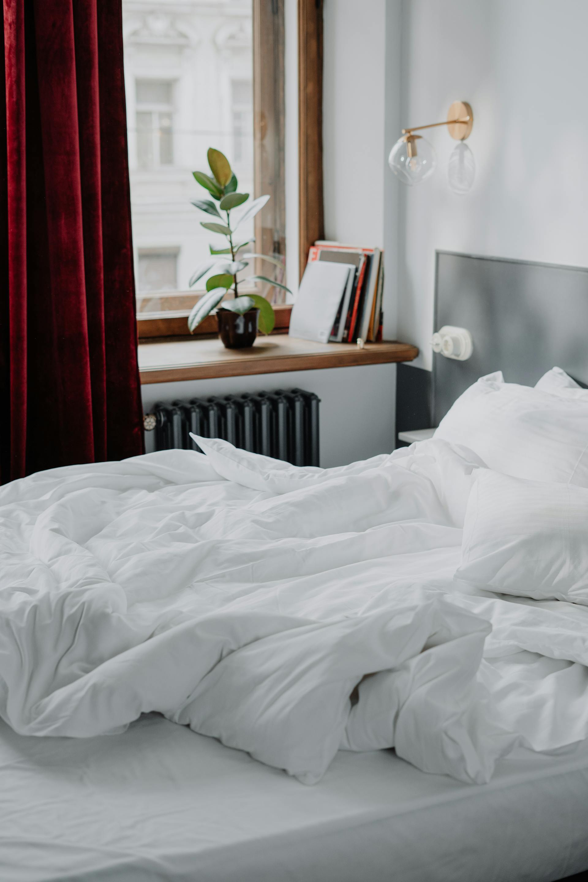 Bright bedroom with fresh linen — laundry delivered before 3pm