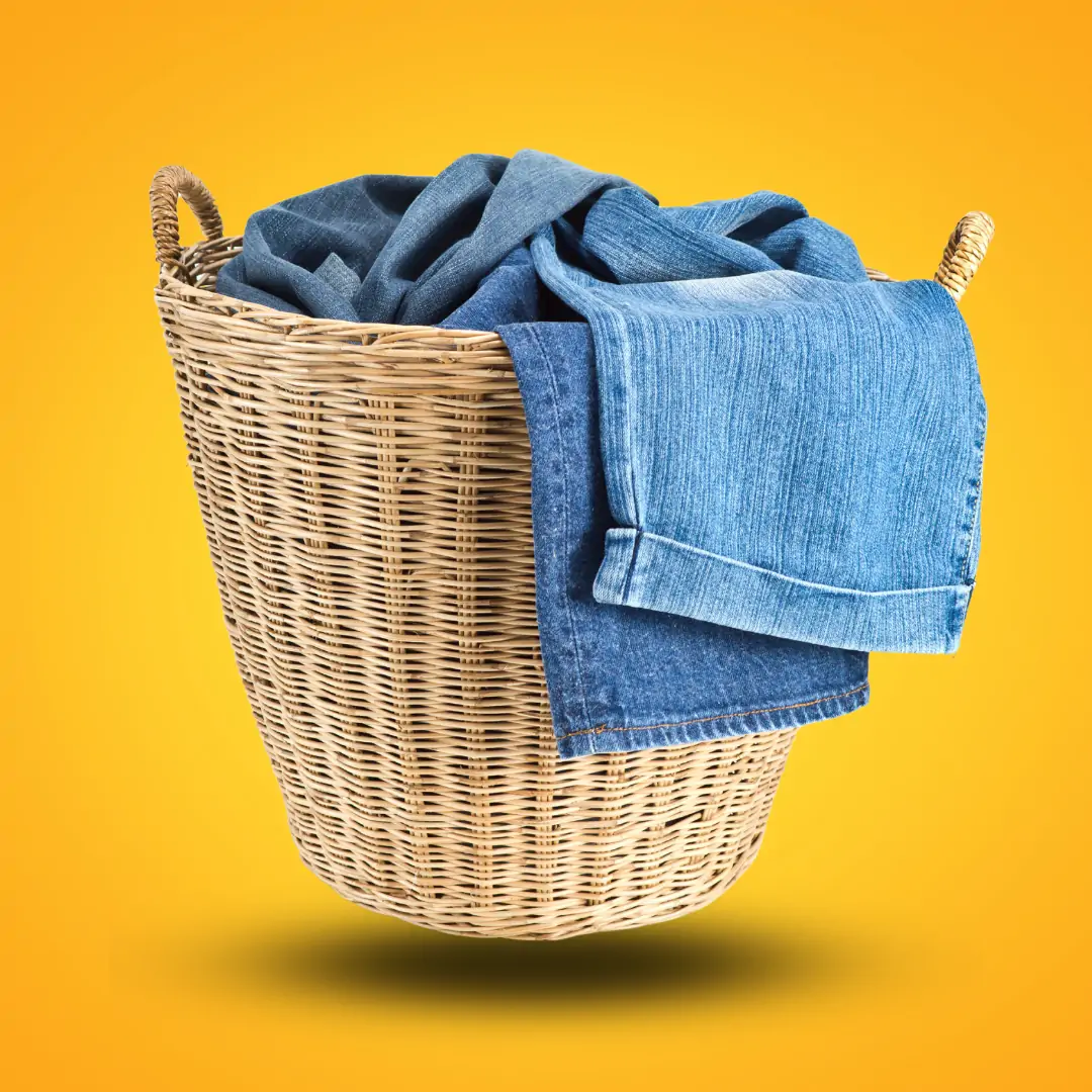 WashMe team member with neatly folded clean laundry, ready for delivery in Marbella