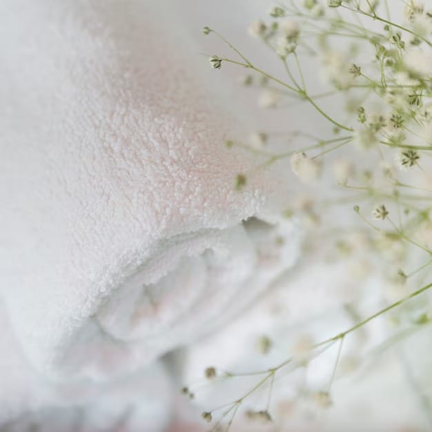 Stacked white towels 23