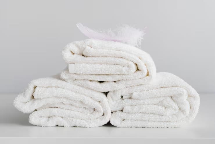Front view stacked white towels 23