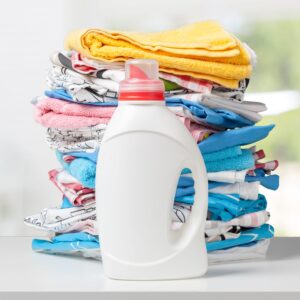 Colorful towels and liquid laundry detergent